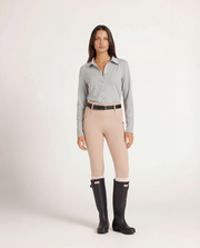 Milrey Callie long sleeve riding blouse in steel blue, worn by a model — technical equestrian polo blouse.