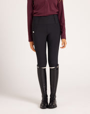 Women's high-rise knee grip black equestrian breeches for horse riding, designed with performance stretch fabric, supportive waistband, flattering seam lines, and functional pockets. Versatile riding pants for schooling, casual rides, barn days, and everyday equestrian wear.