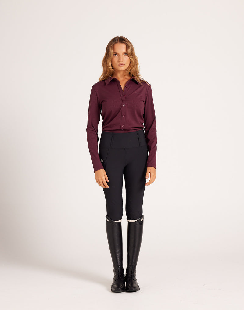 Women's high-rise knee grip black equestrian breeches for horse riding, designed with performance stretch fabric, supportive waistband, flattering seam lines, and functional pockets. Versatile riding pants for schooling, casual rides, barn days, and everyday equestrian wear.