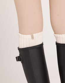 Women's knee-high ribbed slouch socks. Neutral cream socks. 100% soft cotton casual socks ideal for off-duty looks, gumboots, and everyday wear.
