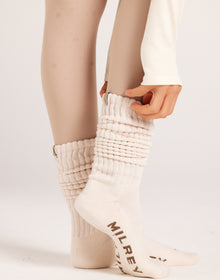 Women's knee-high ribbed slouch socks. Neutral cream socks. 100% soft cotton casual socks ideal for off-duty looks, gumboots, and everyday wear.