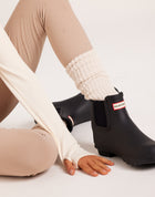 Women's knee-high ribbed slouch socks. Neutral cream socks. 100% soft cotton casual socks ideal for off-duty looks, gumboots, and everyday wear.
