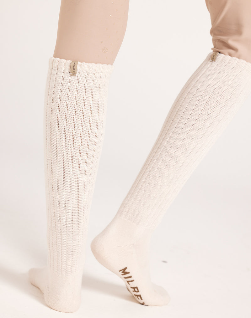Women's knee-high ribbed slouch socks. Neutral cream socks. 100% soft cotton casual socks ideal for off-duty looks, gumboots, and everyday wear.
