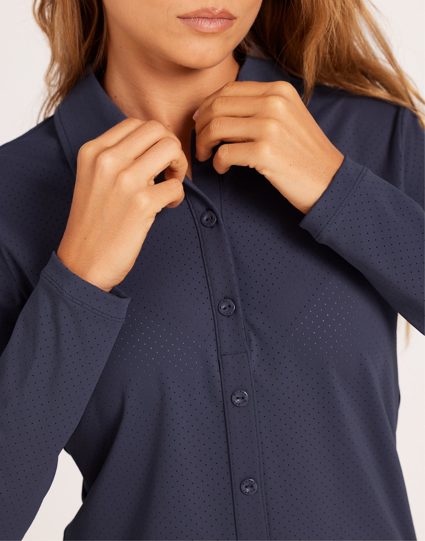 Milrey Callie long sleeve riding blouse in navy, worn by a model — technical equestrian polo blouse.