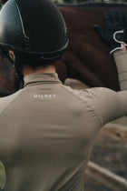 Back of the Mia Mock Neck in khaki showing the Milrey logo